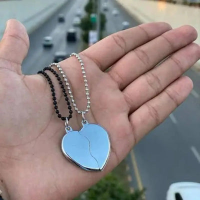 Silver broken heart necklace with custom engraved names, featuring a split heart pendant on a sterling silver chain. Perfect for couples, best friends, or family gifts.