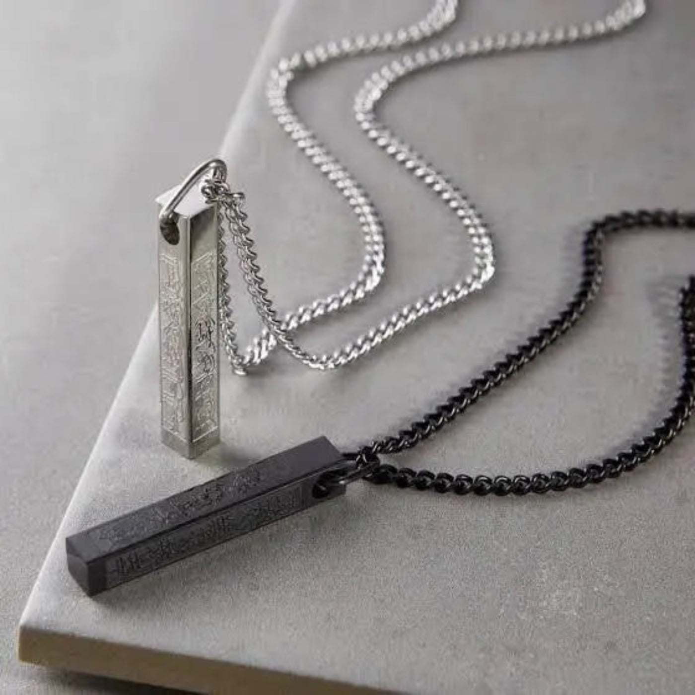 Ayatul Kursi bar locket with Arabic engraving on a sleek metal pendant, unisex Islamic necklace for protection and style.