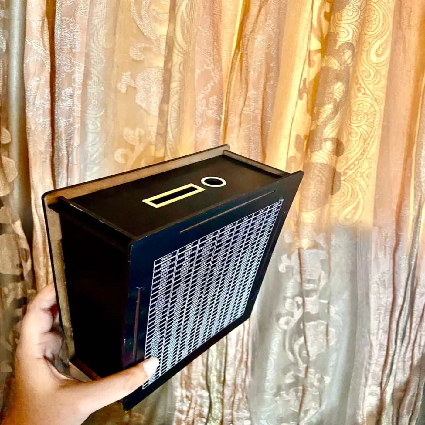 Top view of wooden Kurbani saving box with money slot